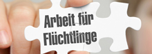 Puzzleteil mit Aufschrift "Arbeit für Flüchtlinge"