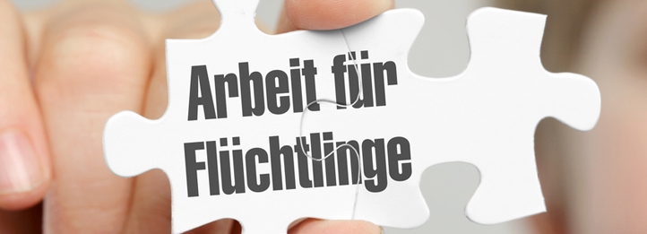 Puzzleteil mit Aufschrift "Arbeit für Flüchtlinge"